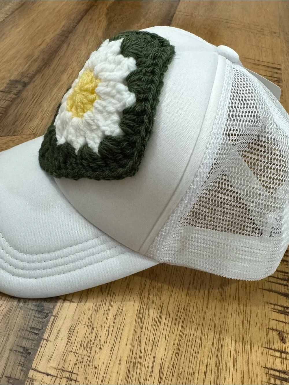 White Trucker Hat with Green Crochet Daisy Patch